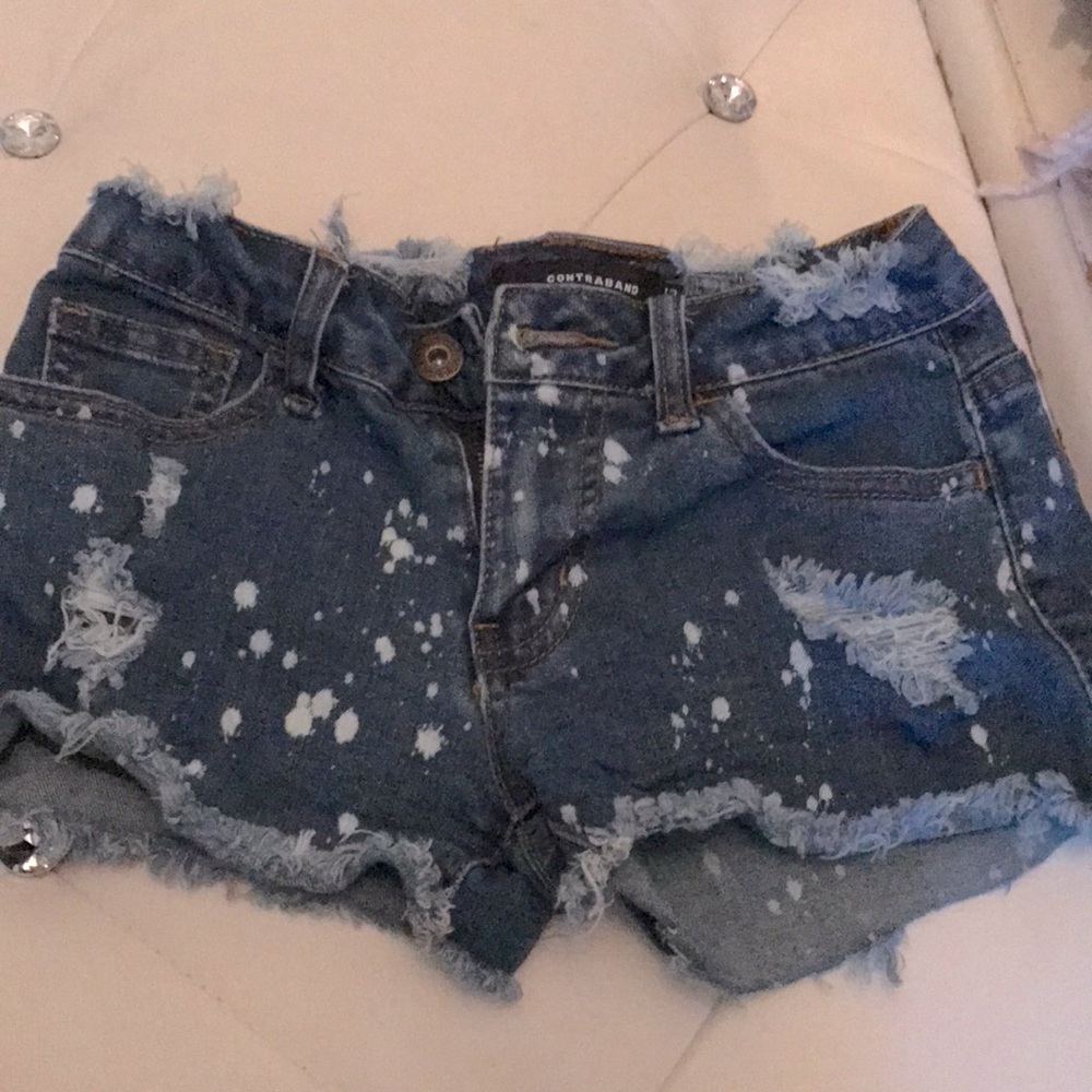 Distressed splatter jean shorts